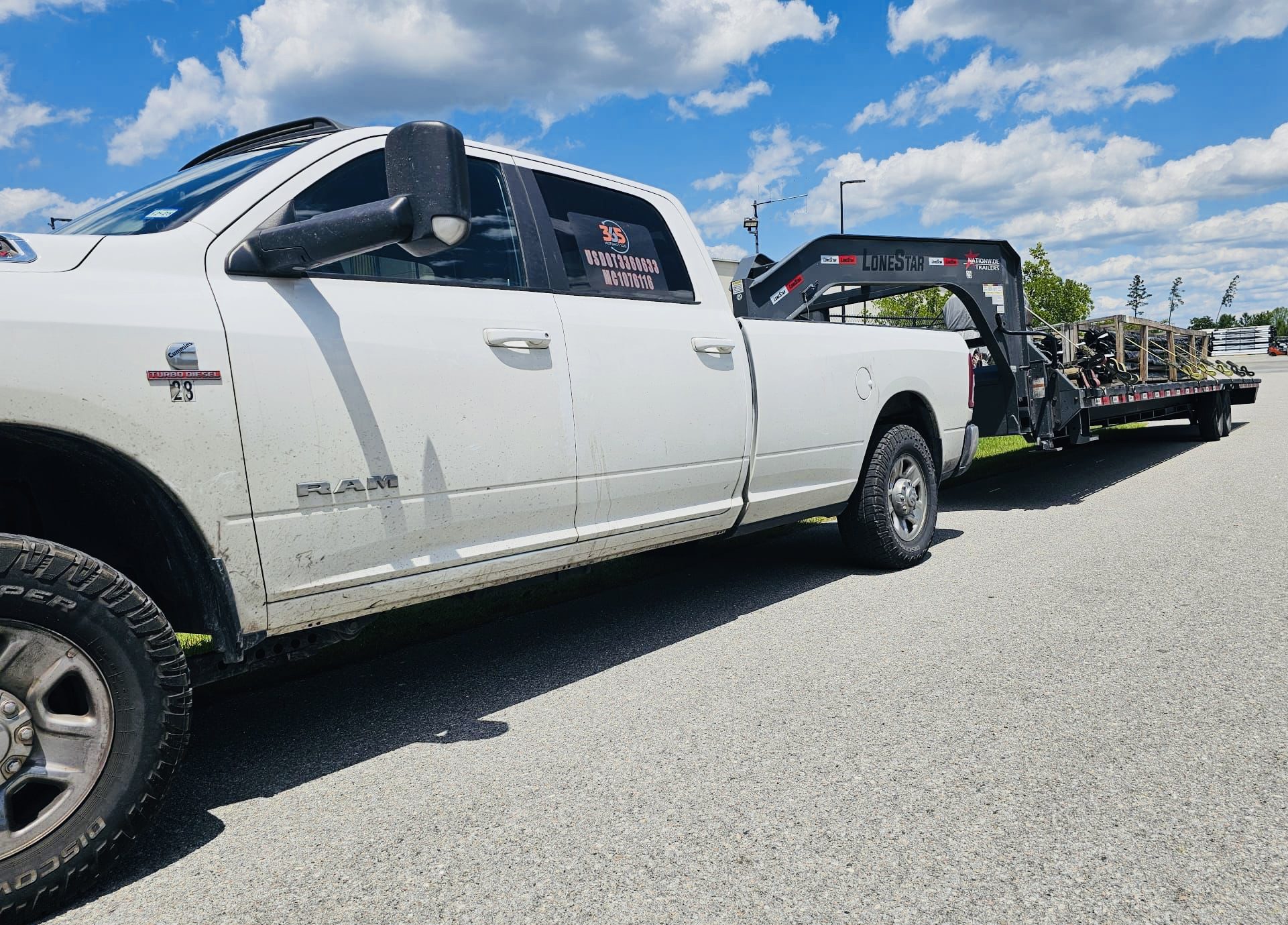 use for website A white truck with a tow truck on the back of it.